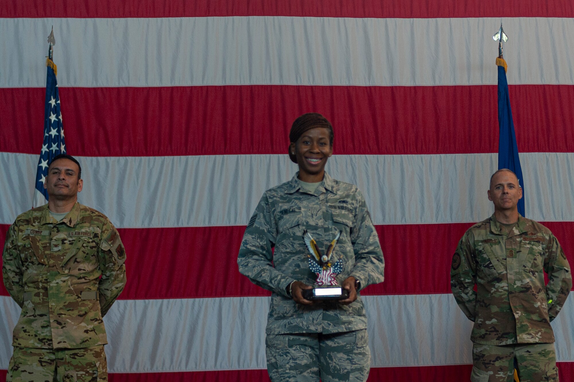 Photo of an Airman receiving an award