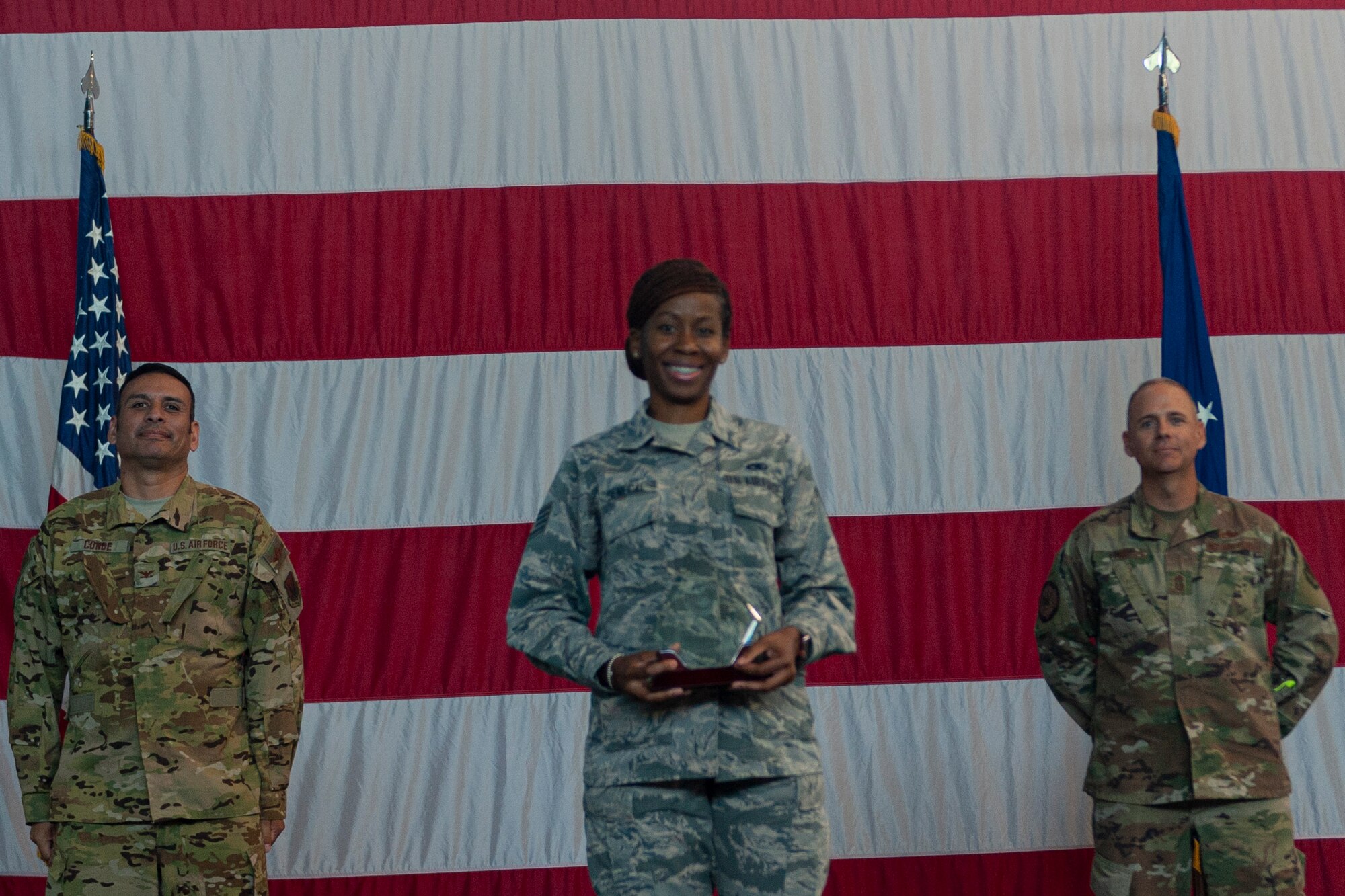 Photo of an Airman receiving an award