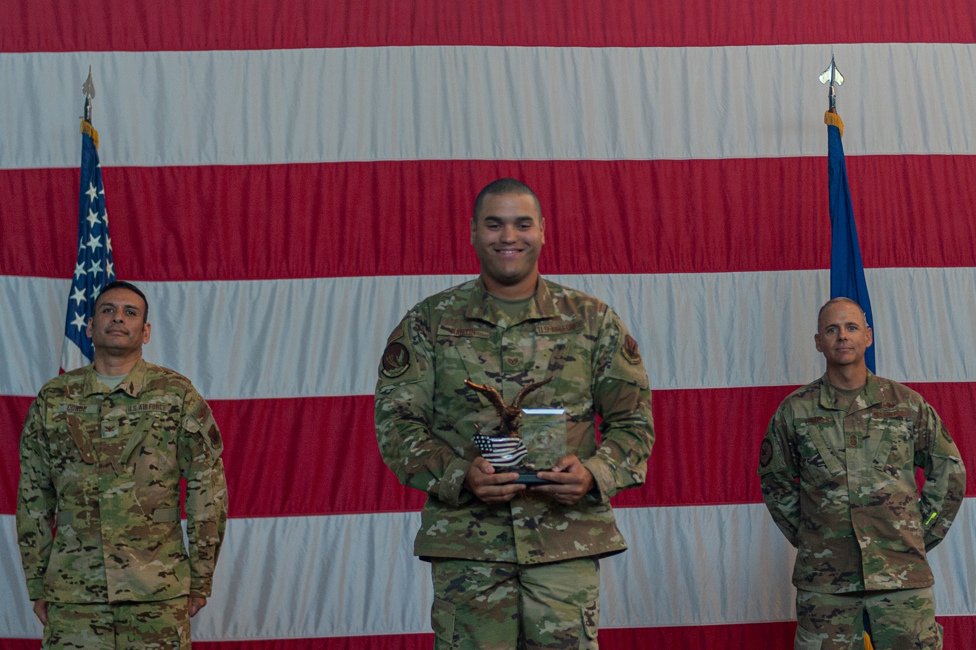 Photo of an Airman receiving an award