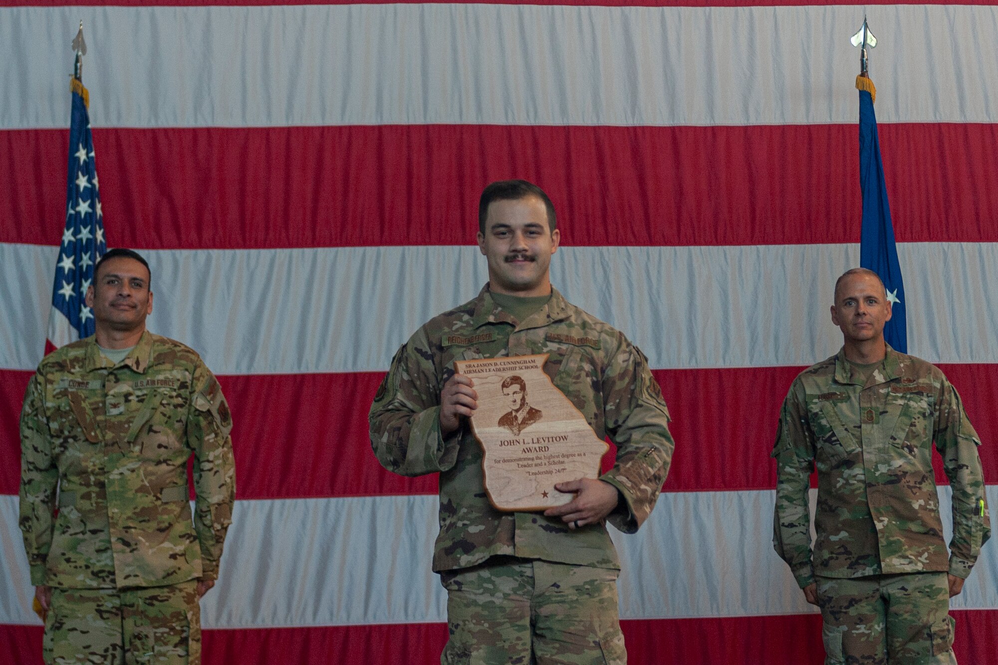 Photo of an Airman receiving an award