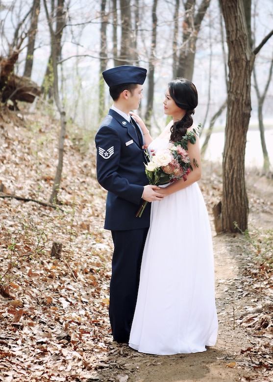 U.S. Air Force Tech. Sgt. Samuel Han, 316th Training Squadron instructor and bride, Erin, pose for a wedding photo in 2014. The two met while Han was on a military assignment in South Korea. (Courtesy photo)