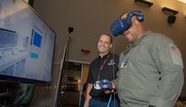 Senior chief uses virtual reality to manipulate a hardware rack