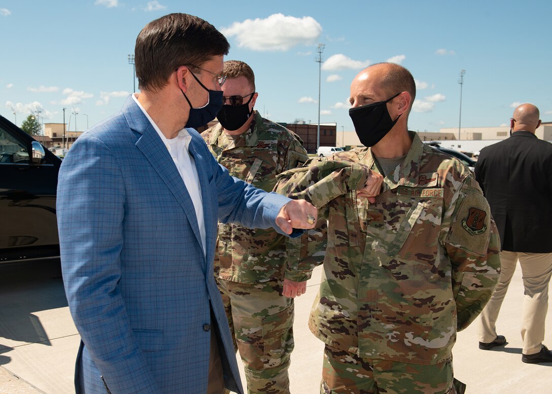 U.S. Secretary of Defense, Dr. Mark T. Esper, bids a socially-distant farewell to Col. Matthew Calhoun, 131st Bomb Wing commander, at Whiteman Air Force Base, Missouri, July 22, 2020. Esper visited Whiteman to engage with Airmen and senior leaders in order to get a firsthand understanding of the operations and support of the B-2 Spirit stealth bomber. (U.S. Air Force photo by Senior Airman Thomas Barley)