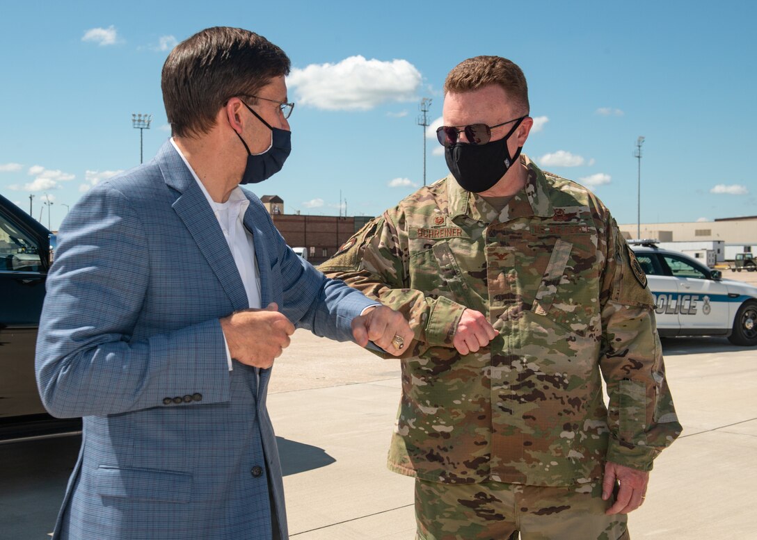 U.S. Secretary of Defense Dr. Mark T. Esper bids a socially distanced farewell to Col. Jeffrey Schreiner, 509th Bomb Wing commander, at Whiteman Air Force Base, Missouri, July 22, 2020. Esper visited Whiteman AFB to engage with Airmen and senior leaders and get a firsthand understanding of the operations supporting the B-2 Spirit stealth bomber. Schreiner is responsible for the combat readiness of the Air Force's only B-2 base, including the development and employment of the B-2's combat capability as part of Air Force Global Strike Command. (U.S. Air Force photo by Senior Airman Thomas Barley)