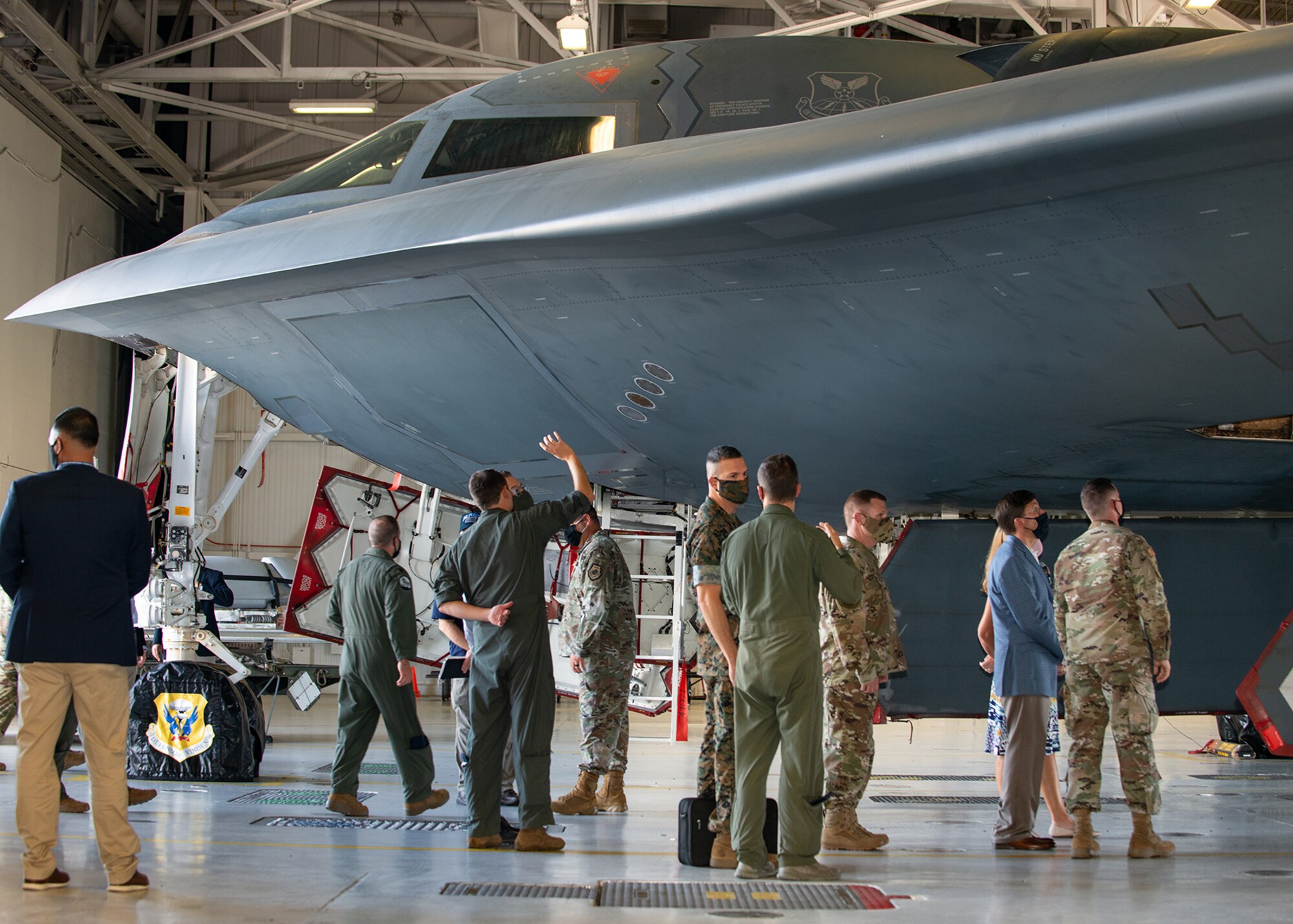 U.S. Secretary of Defense, Dr. Mark T. Esper, speaks with 131st and 509th Bomb Wing maintainers during a visit at Whiteman Air Force Base, Missouri, July 22, 2020. During his visit, Esper received an in-person introduction to various aspects of Team Whiteman's mission, total force integration between the active duty and Air National Guard wings, and ensuring the B-2 Spirit stealth bomber's combat readiness during COVID-19. (U.S. Air Force photo by Senior Airman Thomas Barley)