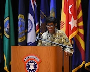 a female soldier giving a speech.