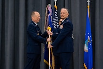 Col. Michael A. Miller, right, outgoing 2nd Bomb Wing commander, relinquishes the guidon to Maj. Gen. Mark E. Weatherington, left, 8th Air Force and Joint-Global Strike Operations Center commander, during a change of command ceremony at Barksdale Air Force Base, La., July 23, 2020. The passing of a squadron’s guidon symbolizes a transfer of command. (U.S. Air Force photo by Airman 1st Class Jacob B. Wrightsman)