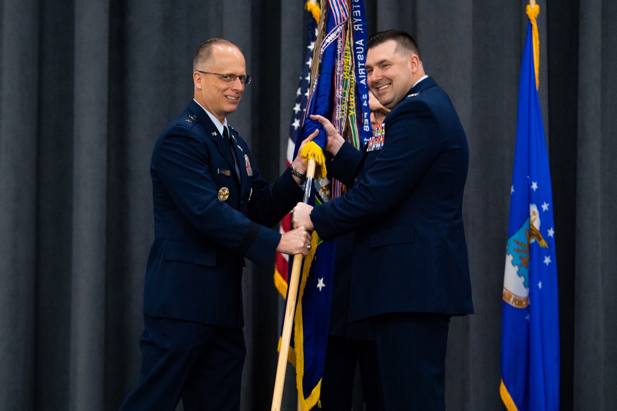 Col. Mark C. Dmytryszyn, right, incoming 2nd Bomb Wing commander, receives the guidon from Maj. Gen. Mark E. Weatherington, 8th Air Force and Joint-Global Strike Operations Center commander, during a change of command ceremony at Barksdale Air Force Base, La., July 23, 2020. The passing of a squadron’s guidon symbolizes a transfer of command. (U.S. Air Force photo by Airman 1st Class Jacob B. Wrightsman)