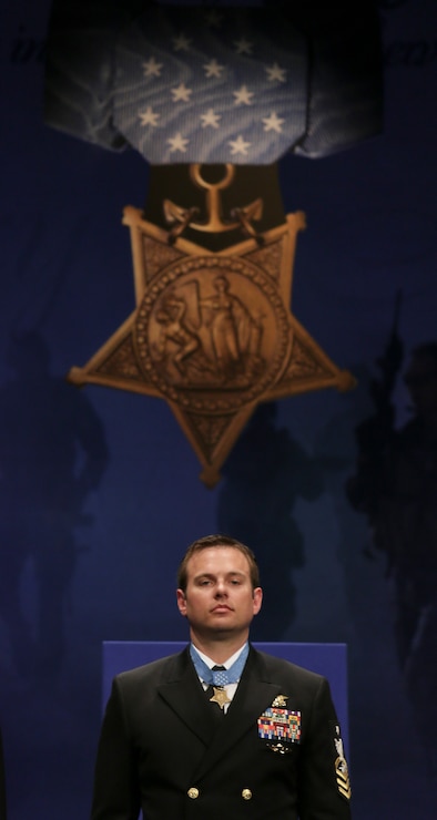 Edward C. Byers Jr., stands at attention during his Hall of Heroes induction ceremony