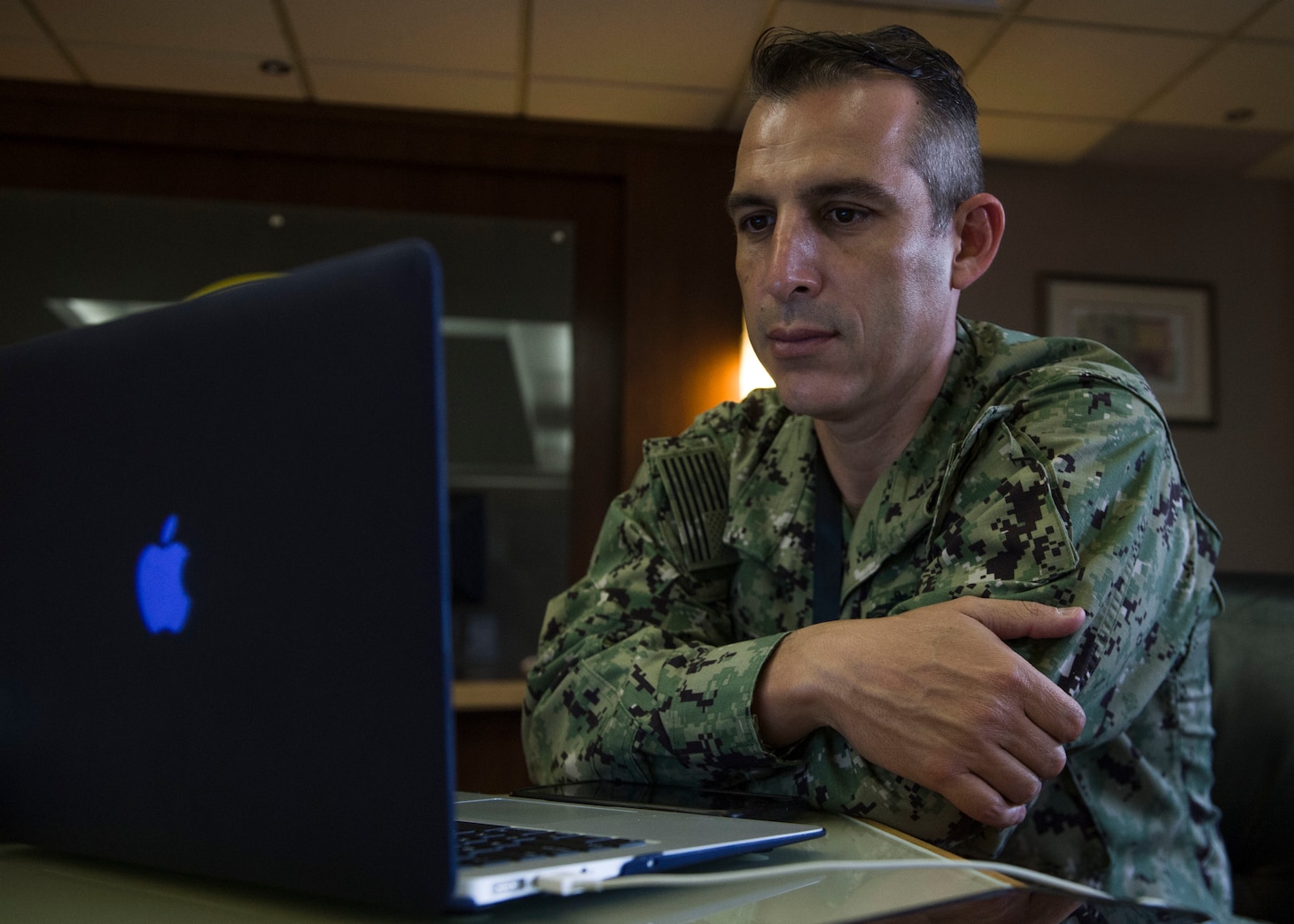 SINGAPORE (July 23, 2020) Lt. Carlos Prieto, intelligence officer assigned to Commander, Logistics Group Western Pacific, observes a presentation during Southeast Asia Cooperation and Training (SEACAT) 2020. SEACAT promotes shared commitments to maritime partnerships, security and stability in Southeast Asia. This year, SEACAT takes shape as a virtual maritime domain awareness symposium with representatives from 22 participating nations.