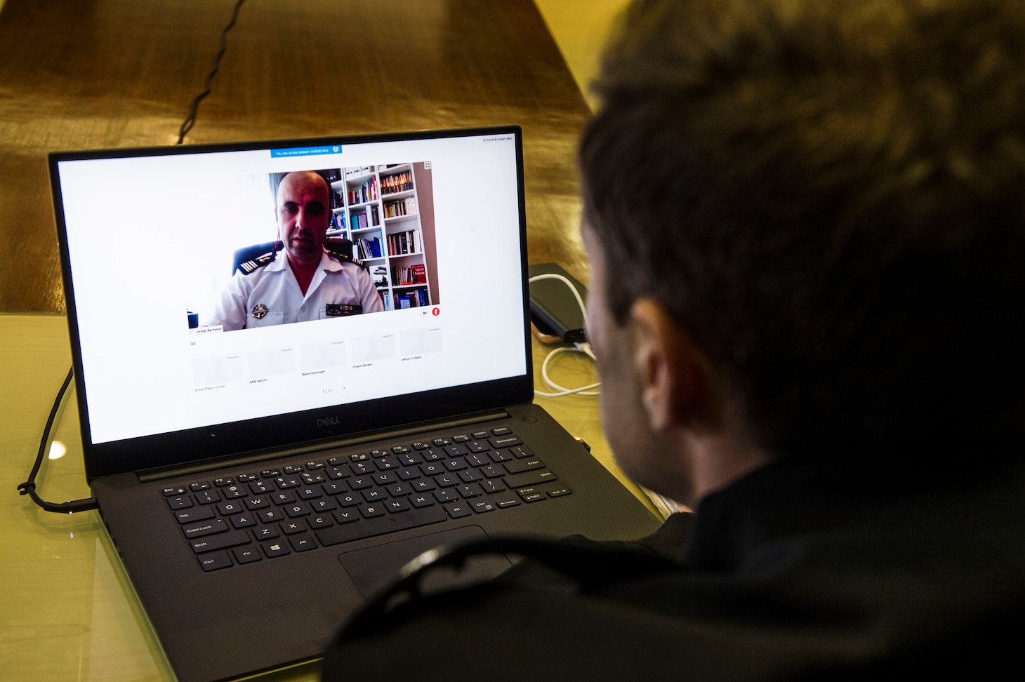 SINGAPORE (July 21, 2020) Lt. Cmdr. Jeff Ryan, exercise planner assigned to Commander, Logistics Group Western Pacific, observes as French Navy Cmdr. Jérémy Bachelier discusses the French Navy’s operations in support of Southeast Asia Cooperation and Training (SEACAT) 2020. SEACAT promotes shared commitments to maritime partnerships, security and stability in Southeast Asia. This year, SEACAT takes shape as a virtual maritime domain awareness symposium with representatives from 22 participating nations.