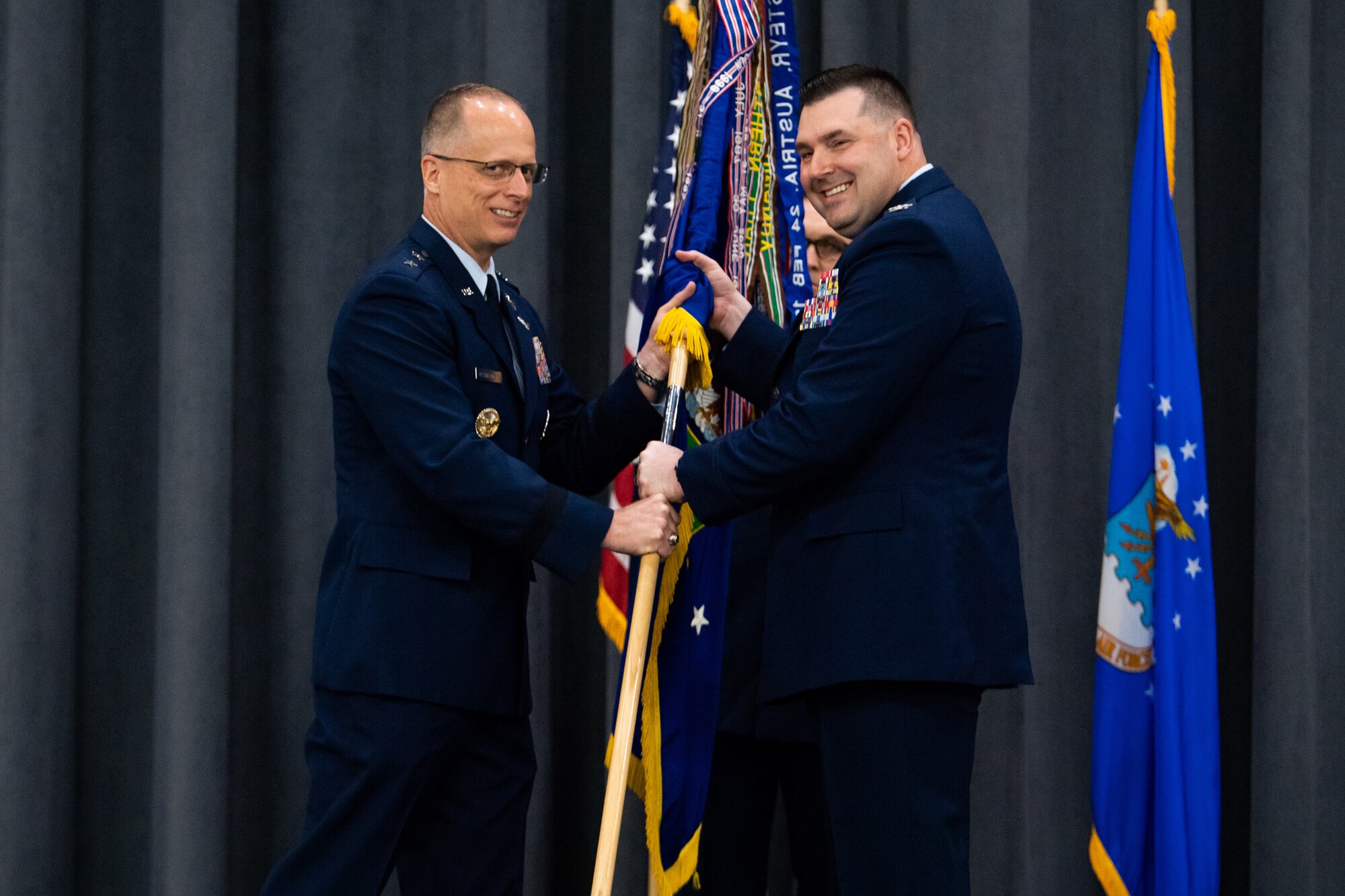 Col. Mark C. Dmytryszyn, right, incoming 2nd Bomb Wing commander, receives the guidon from Maj. Gen. Mark E. Weatherington, 8th Air Force and Joint-Global Strike Operations Center commander, during a change of command ceremony at Barksdale Air Force Base, La., July 23, 2020. The passing of a squadron’s guidon symbolizes a transfer of command. (U.S. Air Force photo by Airman 1st Class Jacob B. Wrightsman)