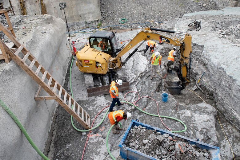 Shimmick construction workers prepare the riverbed inside a coffer dam July 21, 2020 in preparation to place more concrete for a monolith. The U.S. Army Corps of Engineers Nashville District is constructing a new navigation lock as part of the Chickamauga Lock Replacement Project at the Tennessee Valley Authority project on the Tennessee River in Chattanooga, Tennessee. (USACE Photo by Lee Roberts)