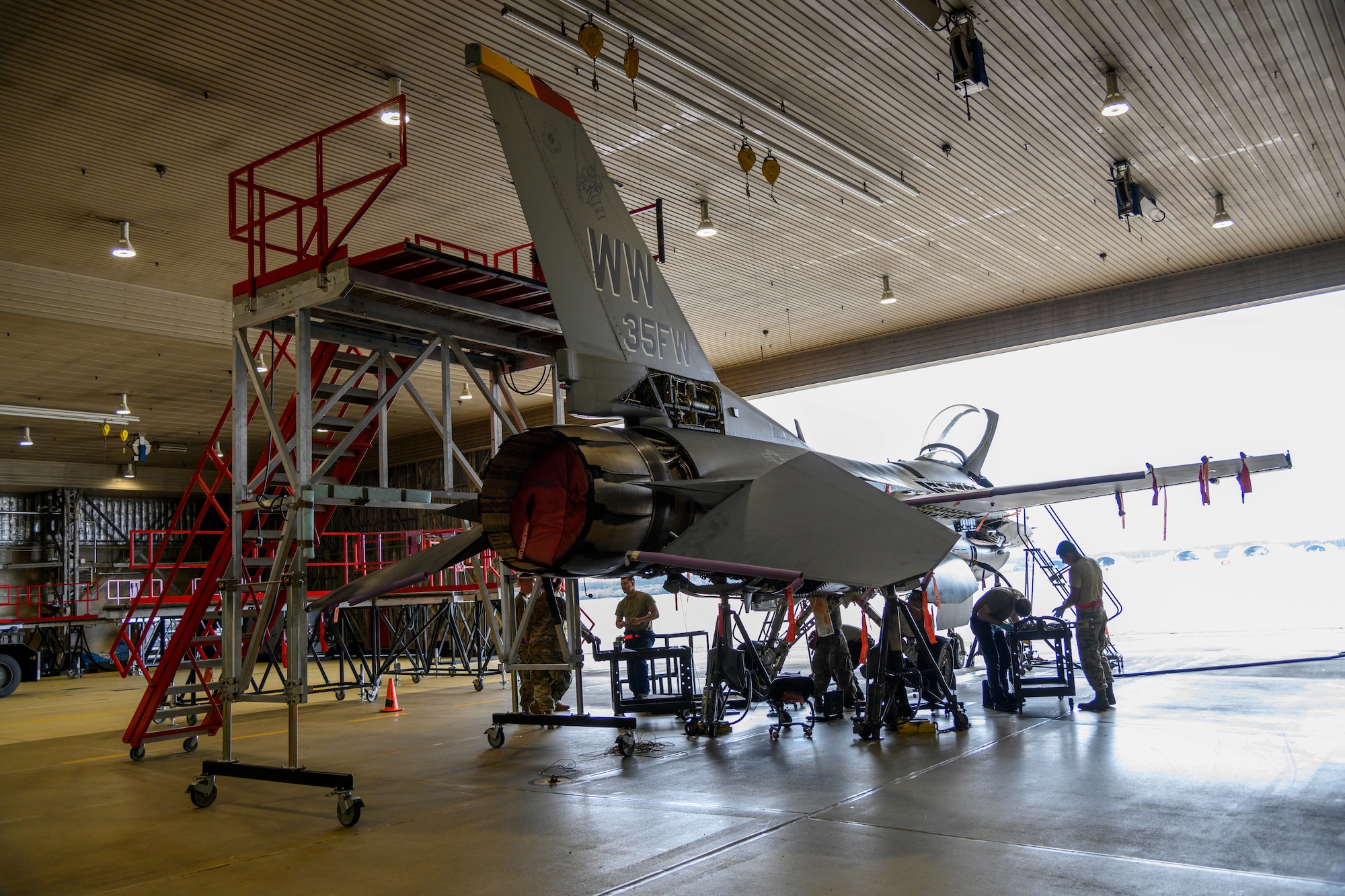 U.S. Air Force Airmen from the 35th Maintenance Squadron Phase Inspection section inspect an F-16 Fighting Falcon at Misawa Air Base, Japan, July 22, 2020. The 35th MXS Phase Inspection section Airmen thoroughly inspect and identify discrepancies before they become big problems, allowing Misawa jets to be at the ready for the mission. (U.S. Air Force photo by Airman 1st Class China M. Shock)