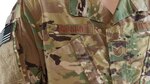 OCP rank insignia, badges, name, and service tapes will now feature a lighter, three-color background pattern, versus the current seven-color pattern, to increase readability and ease rank recognition.