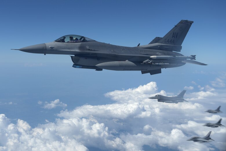 Military aircraft in formation, mid air.