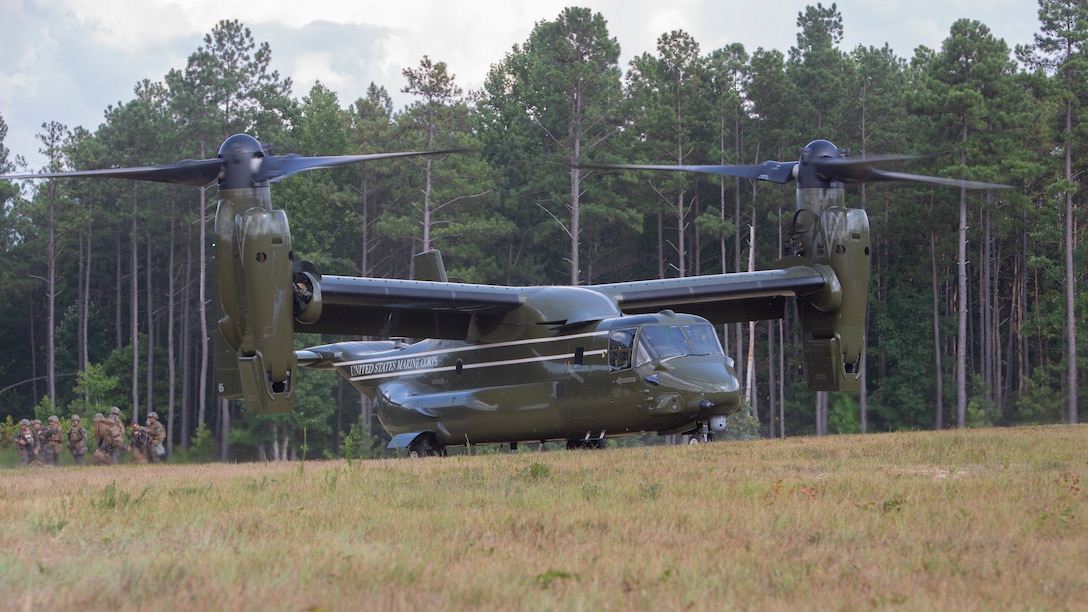 U.S. Marines with Charlie Company, 3rd Platoon, Marine Corps Security Forces, U.S. Marine Corps Forces Command, Fleet Marine Force Atlantic, disembark from an MV-22B Osprey assigned to Marine Helicopter Squadron One during a Mission Readiness Exercise (MRX) on July 21, 2020, on Fort A. P. Hill in Port Royal, Virginia. Hill. The airborne tactical insertion allows Marines to rapidly deploy and reach their objectives. Fleet Antiterrorism Security Team (FAST) platoons execute MRX exercises prior to deployment to evaluate the platoons’ proficiency in core mission essential tasks. (U.S. Marine Corps Photo by Sgt. Desmond Martin/Released)