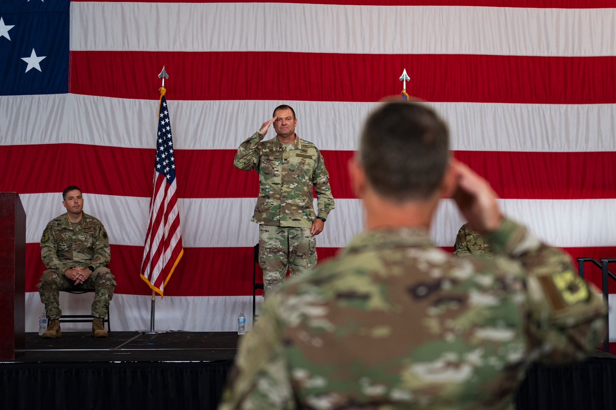 A photo of the Mission Support Group commander receiving a final salute
