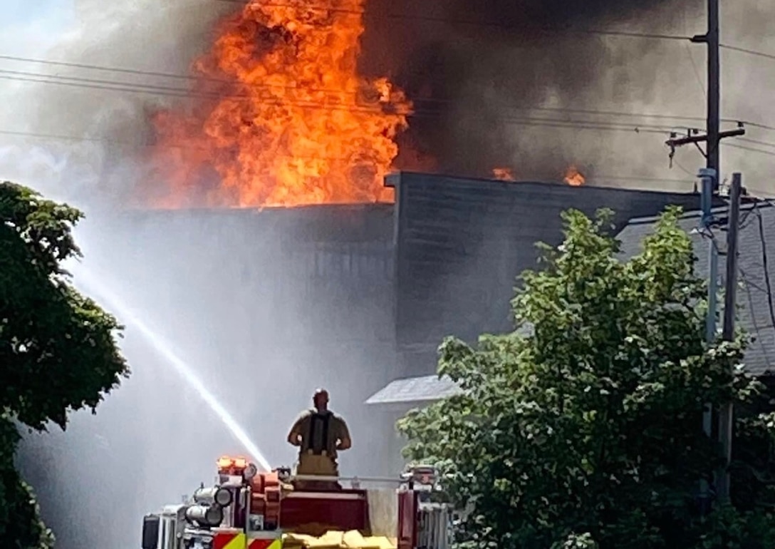 Firefighters from the Michigan Air National Guard’s Alpena Combat Readiness Training Center and the New York Air National Guard’s 106th Rescue Wing respond to a request for mutual-aid support at a massive structure fire in downtown Alpena, Michigan, July 21, 2020.