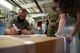 Airmen marking boxes