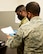 Two Airmen look at a checklist at Creech Air Force Base, Nevada.