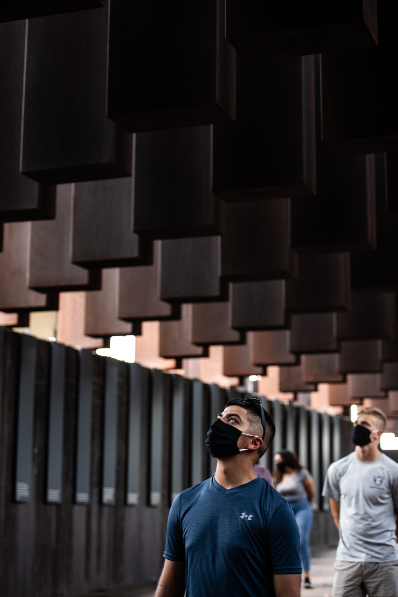 An Air Force Reserve Officer Training Corps cadet training assistant walks through The National Memorial for Peace and Justice.