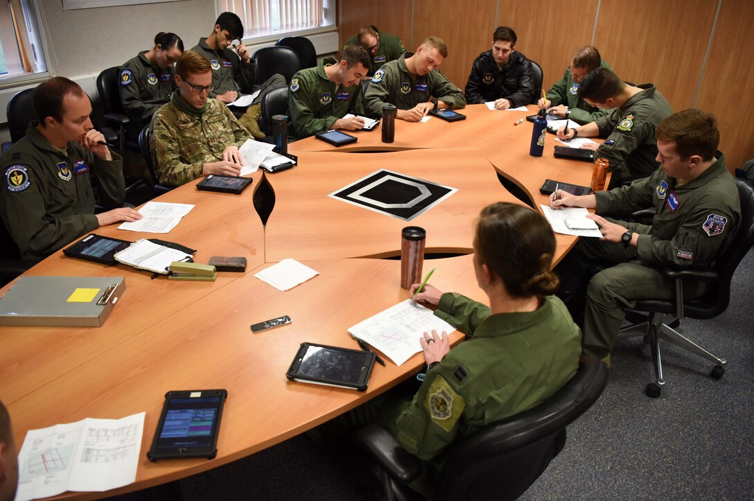 Airmen with the 351st Air Refueling Squadron perform mission briefings at RAF Mildenhall, England, July 23, 2020. The 351st ARS provides operational air refueling, aeromedical evacuation, airlift and rapid contingency response options for U.S. and NATO fighter, bomber and support and reconnaissance aircraft in the European and African theater of operations. (U.S. Air Force photo by Senior Airman Brandon Esau)