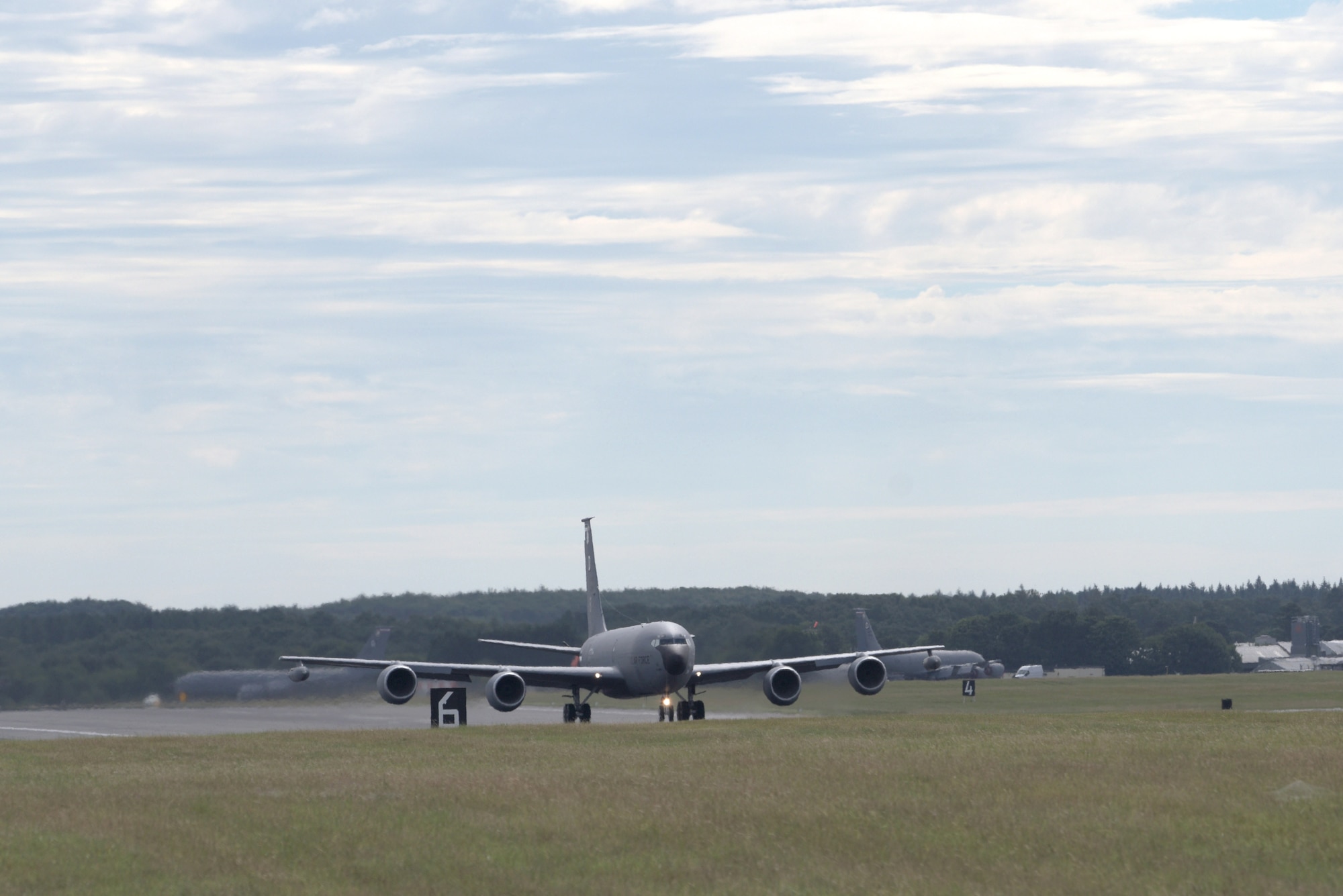 A U.S. Air Force KC-135 Stratotanker, assigned to the 100th Air Refueling Wing, taxis across the runway for takeoff at RAF Mildenahall, July 23, 2020. The 100th ARW is the only permanent U.S. air refueling wing in the European theater, providing the critical air refueling "bridge" which allows the Expeditionary Air Force to deploy around the globe at a moment's notice. (U.S. Air Force photo by Senior Airman Benjamin Cooper)