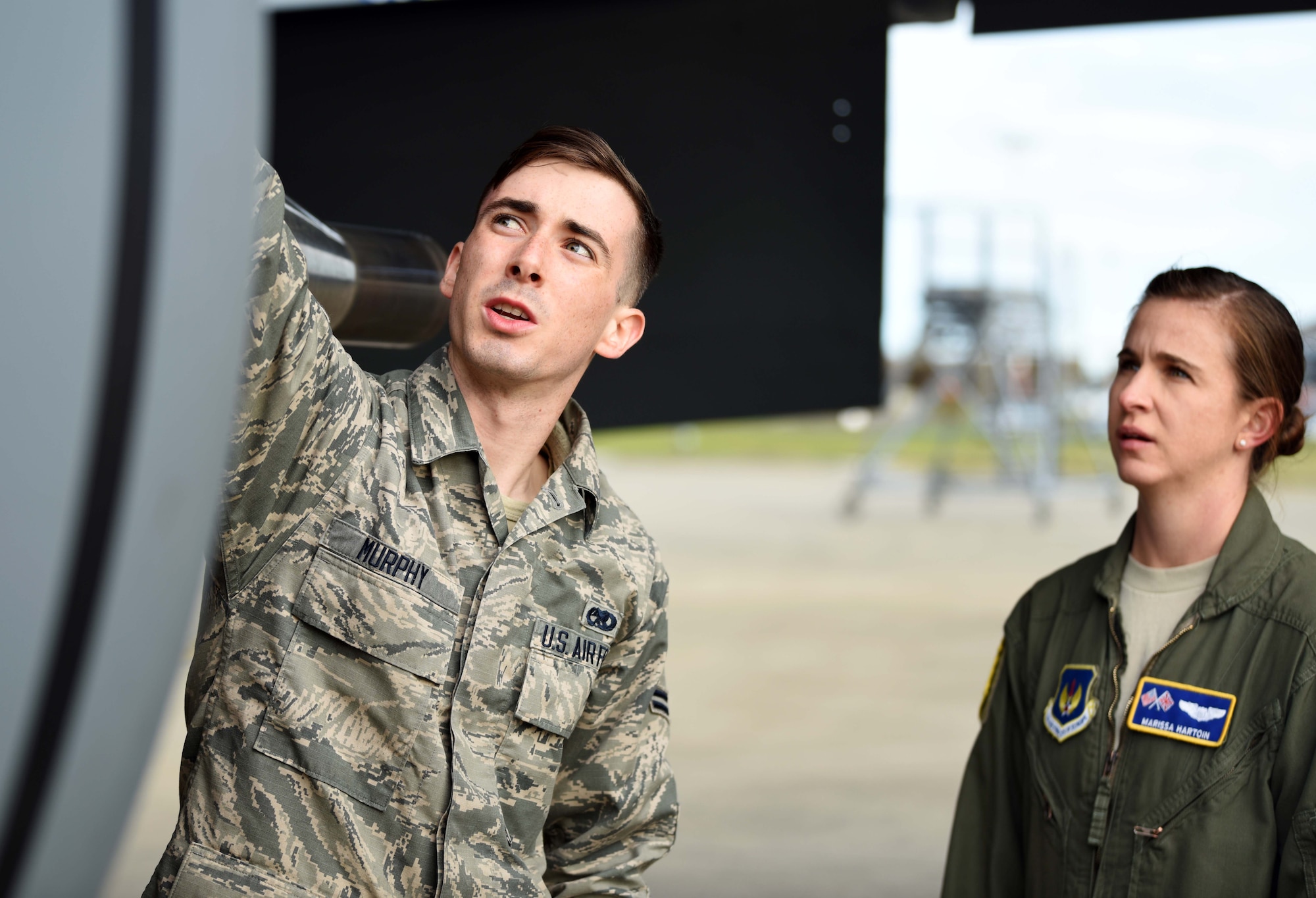 Airman 1st Class Cooper Murphy, 100th Aircraft Maintenance Squadron crew chief, briefs Capt. Marissa Hartoin, 351st Air Refueling Squadron aircraft commander, during a pre-flight check at RAF Mildenhall, England, July 23, 2020. The 351st ARS provides operational air refueling, aeromedical evacuation, airlift and rapid contingency response options for U.S. and NATO fighter, bomber and support and reconnaissance aircraft in the European and African theater of operations. (U.S. Air Force photo by Senior Airman Brandon Esau)