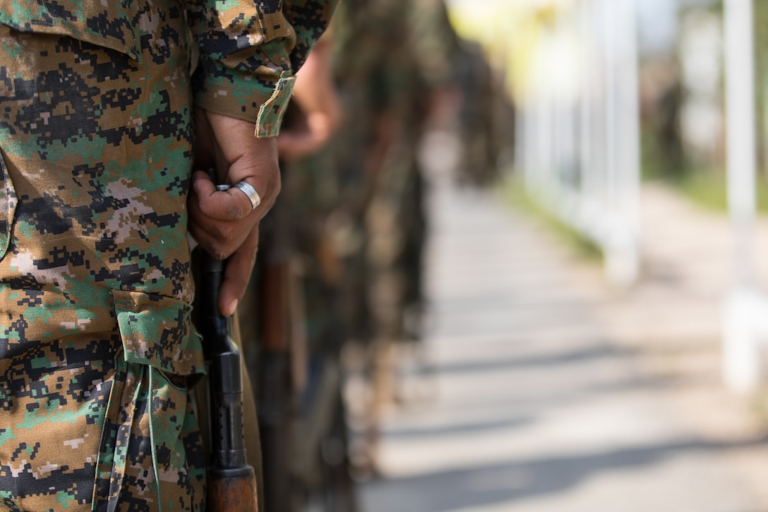 Members of the Syrian Democratic Forces stand in formation during a victory announcement ceremony over the defeat of Daesh’s so-called physical caliphate Mar. 23, 2019 at Omar Academy, Deir ez-Zor, Syria. The Global Coalition will continue addressing the threat Daesh continues to pose to the partner nations and allies, while preventing any return or resurgence in liberated areas. (U.S. Army photo by Staff Sgt. Ray Boyington)