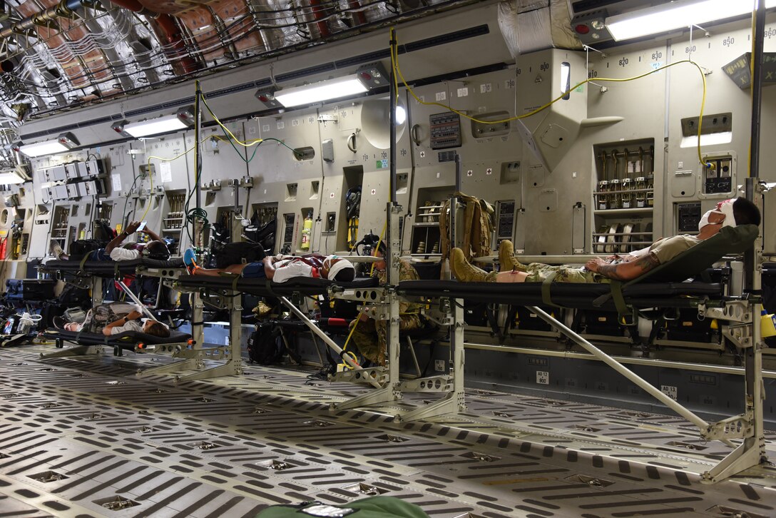 Reserve Citizen Airmen from the 36th Aeromedical Evacuation Squadron and Mississippi Air National Guardsmen from the 183rd AES act as patients being evacuated during a three-day training event, July 20-22, 2020 at Keesler Air Force Base and the Mississippi Air National Guard's Combat Readiness Training Center in Gulfport, Mississippi. The training was a joint effort between Reservists and Guardsmen to work as one team, while training on patient care and handling during a simulated air evacuation of injured service members. (U.S. Air Force photo by Jessica L. Kendziorek)