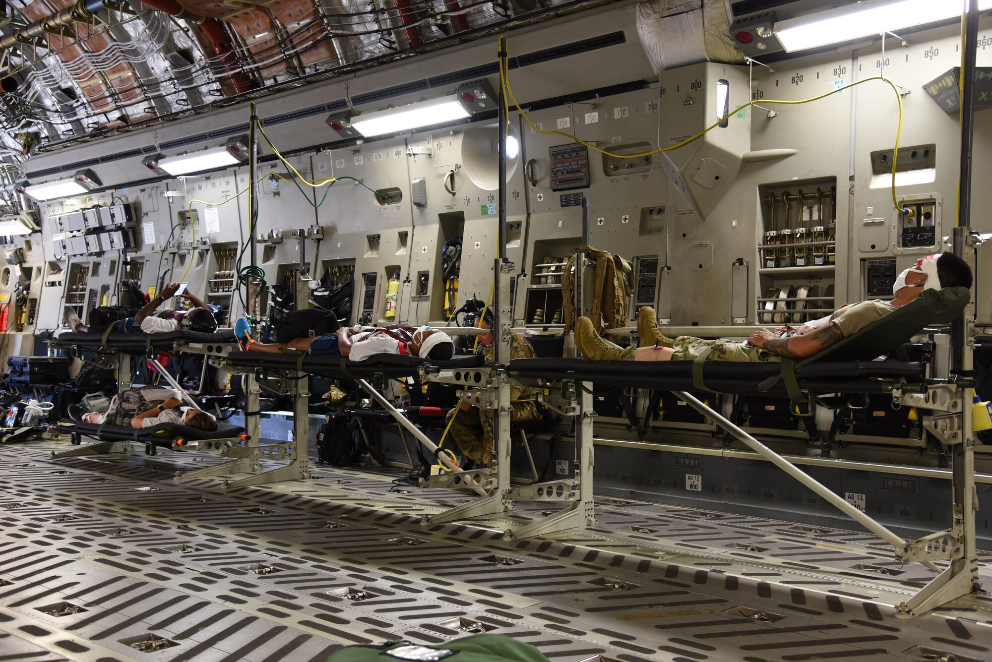 Reserve Citizen Airmen from the 36th Aeromedical Evacuation Squadron and Mississippi Air National Guardsmen from the 183rd AES act as patients being evacuated during a three-day training event, July 20-22, 2020 at Keesler Air Force Base and the Mississippi Air National Guard's Combat Readiness Training Center in Gulfport, Mississippi. The training was a joint effort between Reservists and Guardsmen to work as one team, while training on patient care and handling during a simulated air evacuation of injured service members. (U.S. Air Force photo by Jessica L. Kendziorek)