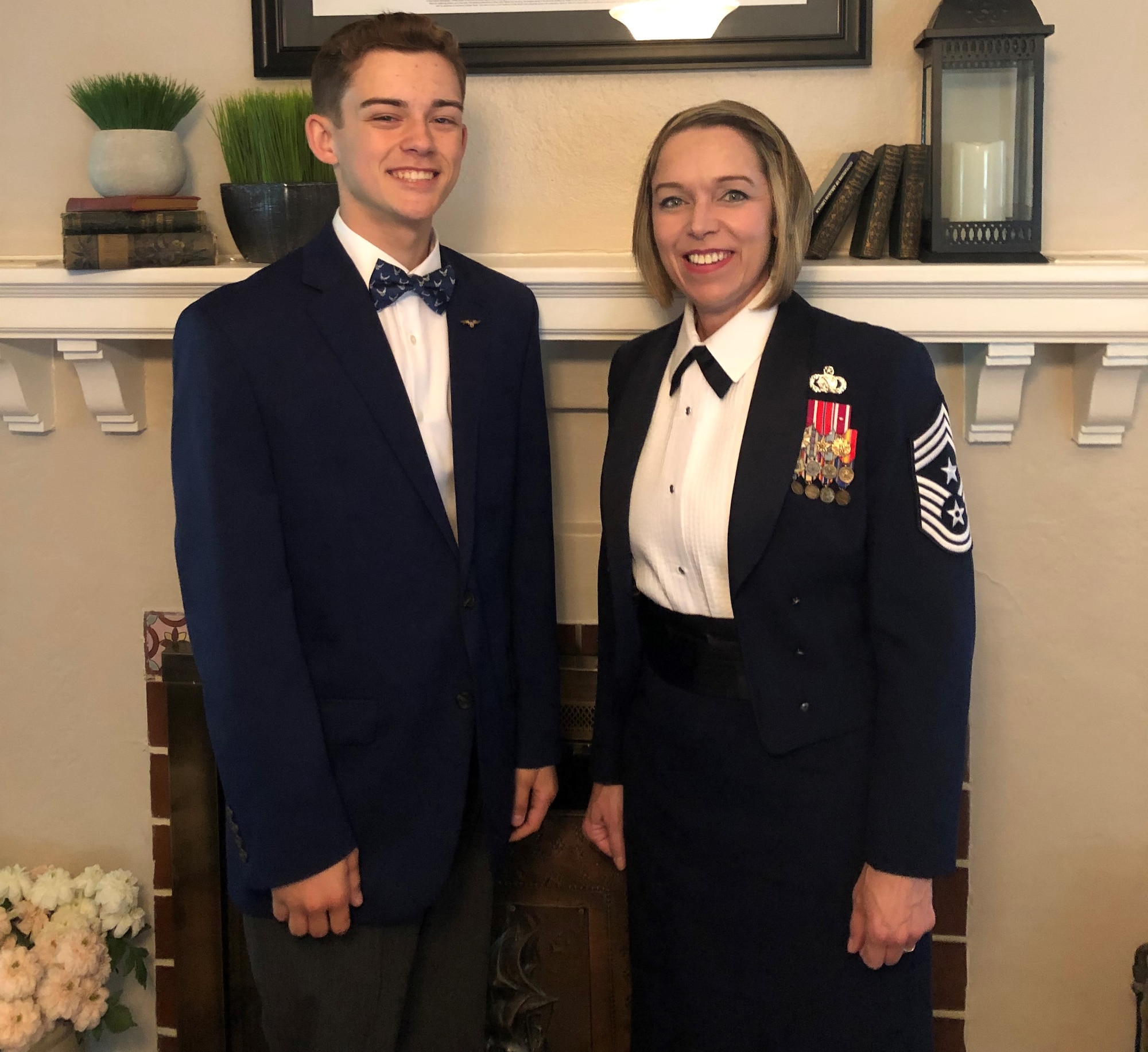 picture of woman in air force uniform and her son in a tux