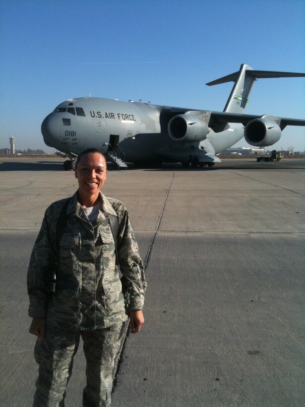 woman in uniform standing on flight line