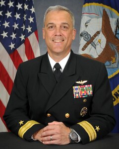 Rear Admiral Andrew J. Loiselle biography portrait.