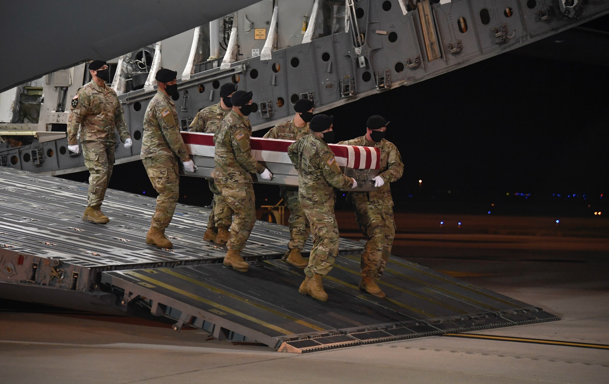 A U.S. Army carry team transfers the remains of Sgt. Bryan C. Mount of St. George, Utah, during a dignified transfer July 26, 2020 at Dover Air Force Base, Delaware. Mount was assigned to the 1st Squadron, 73rd Cavalry Regiment, 2nd Brigade Combat Team, 82nd Airborne Division, Fort Bragg, North Carolina. (U.S. Air Force Photo by Senior Airman Eric M. Fisher)
