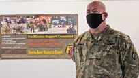 Maj. Jayson Cummins, Task Force Wilkommen support operations officers speaks about processes and procedures of Soldiers arriving to Europe from the United States at the Deployment Processing Center on Rhine Ordnance Barracks in Kaiserslautern, Germany July 17, 2020. The DPC currently houses incoming personnel from the United States undergoing quarantine and in-processing to the European theater. Task Force Wilkommen is a group of organizations facilitating this process during the COVID-19 pandemic. (U.S. Army Reserve photo by Staff Sgt. Chris Jackson/Released)
