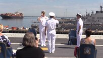 Rear Adm. Roy Kitchener, Commander, Naval Surface Force Atlantic (SURFLANT), center, salutes Adm. Christopher W. Grady, Commander, United States Fleet Forces, left, during the SURFLANT change of command ceremony aboard the San Antonio-class amphibious transport dock ship USS Arlington (LPD 24).