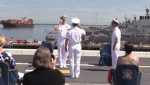 Rear Adm. Roy Kitchener, Commander, Naval Surface Force Atlantic (SURFLANT), center, salutes Adm. Christopher W. Grady, Commander, United States Fleet Forces, left, during the SURFLANT change of command ceremony aboard the San Antonio-class amphibious transport dock ship USS Arlington (LPD 24).