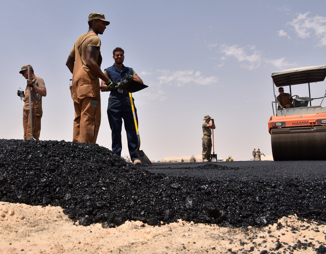 Airmen from the 378th Expeditionary Civil Engineer Squadron Dirt Boys shop work to finish construction on the new helicopter pad at Prince Sultan Air Base, Kingdom of Saudi Arabia.