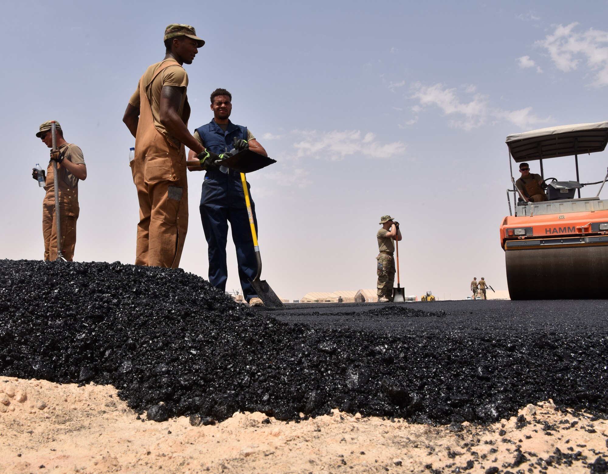 Airmen from the 378th Expeditionary Civil Engineer Squadron Dirt Boys shop work to finish construction on the new helicopter pad at Prince Sultan Air Base, Kingdom of Saudi Arabia.