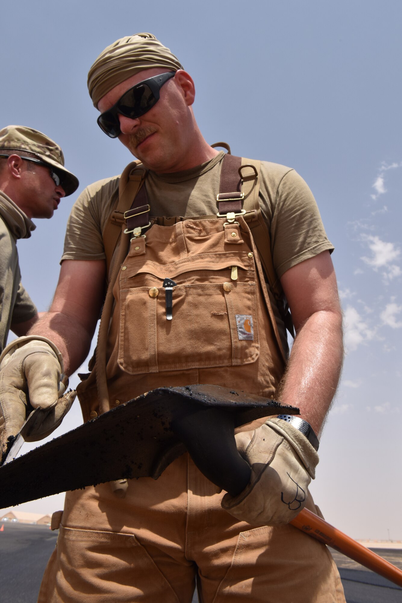 Airmen from the 378th Expeditionary Civil Engineer Squadron Dirt Boys shop work to finish construction on the new helicopter pad at Prince Sultan Air Base, Kingdom of Saudi Arabia.