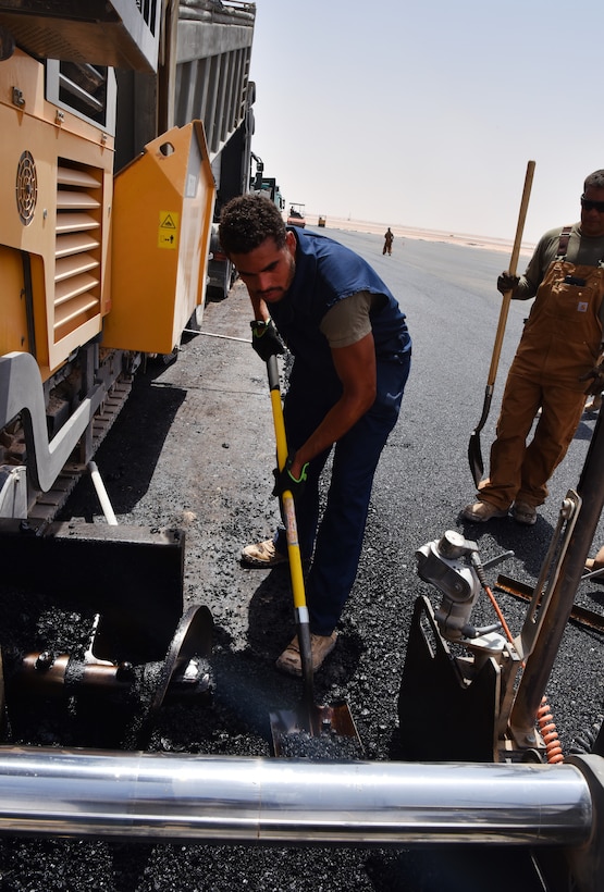 Airmen from the 378th Expeditionary Civil Engineer Squadron Dirt Boys shop work to finish construction on the new helicopter pad at Prince Sultan Air Base, Kingdom of Saudi Arabia.