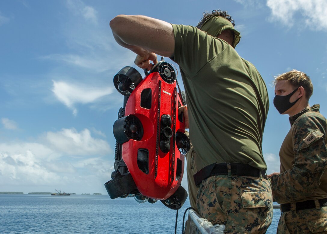 U.S. Marines remove a Strategic Robotics System Fusion Underwater Unmanned Vehicle out of the water during Littoral Explosive Ordnance Neutralization operations aboard the expeditionary Expeditionary Fast Transport (T-EPF 9) USNS City of Bismarck at sea, July 15.