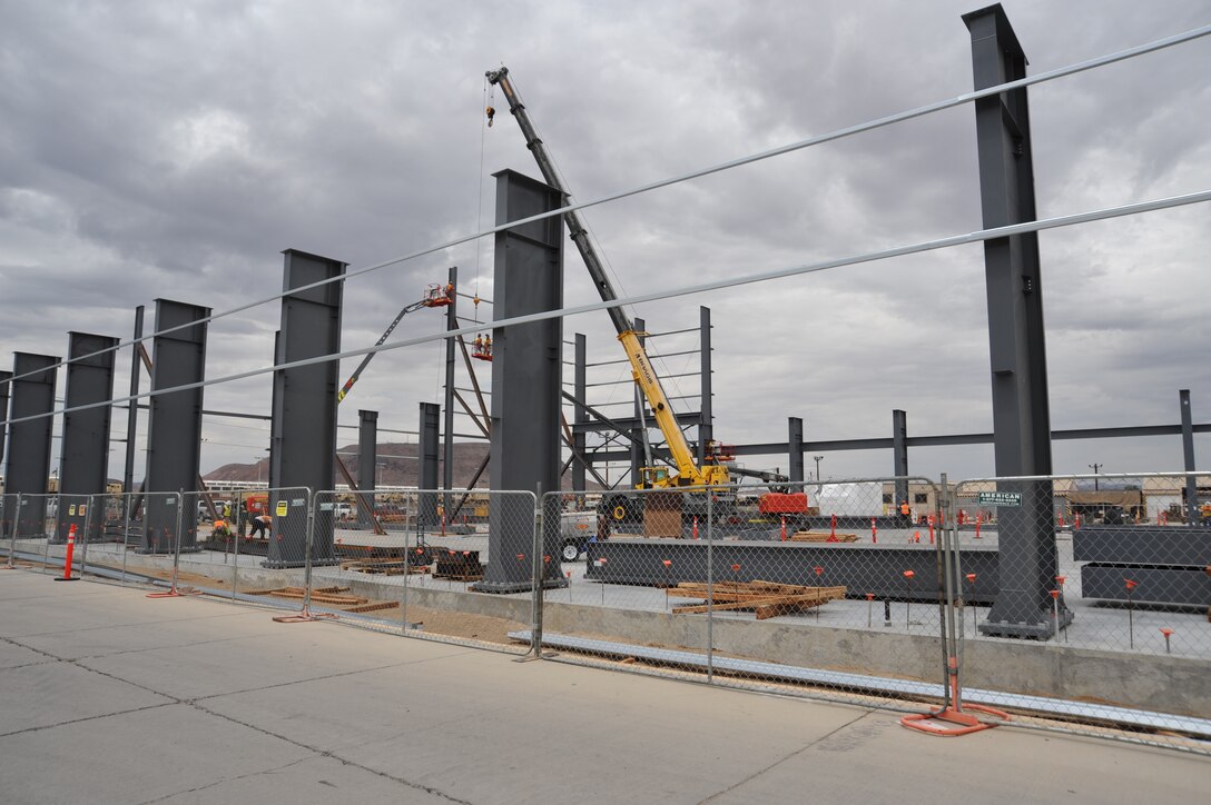 Contractors use a crane to further progress on building the new facility at Production Plant Barstow, Marine Depot Maintenance on the Yermo Annex aboard Marine Corps Logistics Base Barstow, Calif., July 24.