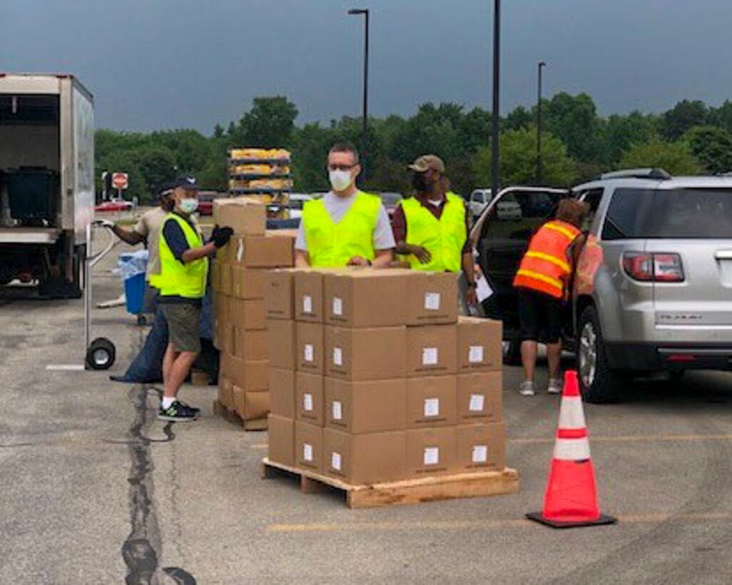 Reserve Citizen Airmen, assigned to the 910th Logistic Readiness Squadron, load food into vehicles on July 7, 2020, at Hickory Highschool in Hermitage, Pennsylvania. The Airmen volunteered their time to support the Community Food Warehouse of Mercer County food drive that serviced approximately 238 vehicles.