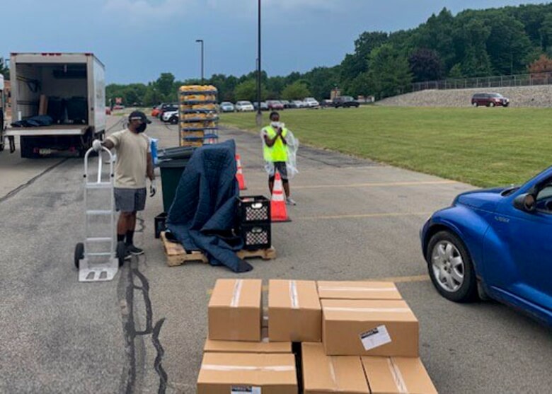Reserve Citizen Airmen, assigned to the 910th Logistic Readiness Squadron, load food into vehicles on July 7, 2020, at Hickory Highschool in Hermitage, Pennsylvania. The Airmen volunteered their time to support the Community Food Warehouse of Mercer County food drive that serviced approximately 238 vehicles.