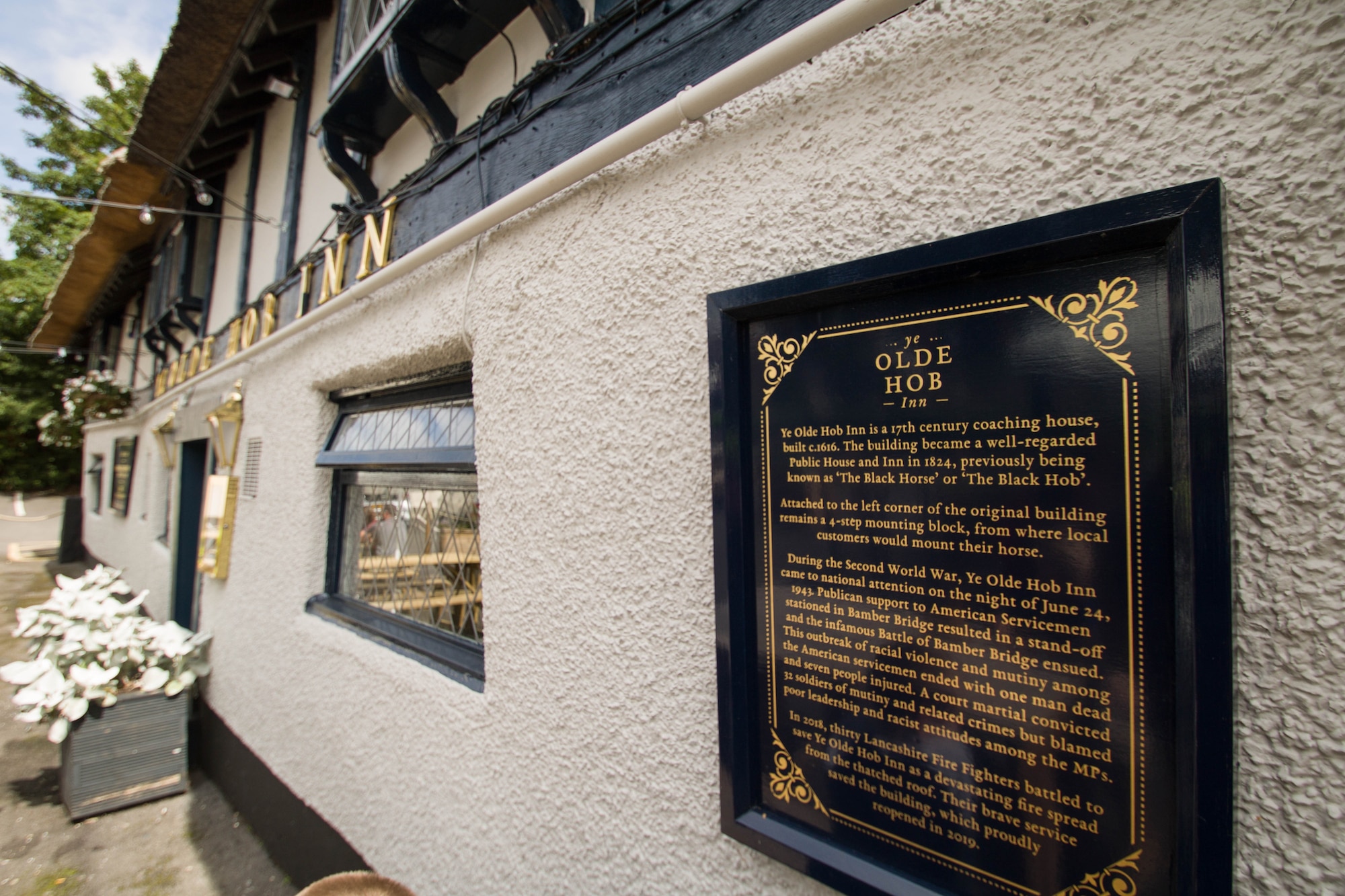 U.S. Air Force Capt. Hans Decker stands in front of Ye Old Hob Inn, the location of an incident of racial violence during World War II. The Battle of Bamber Bridge resulted in the racial integration of American MP patrols and the creation of the Air Force's first Combat Support Wing.