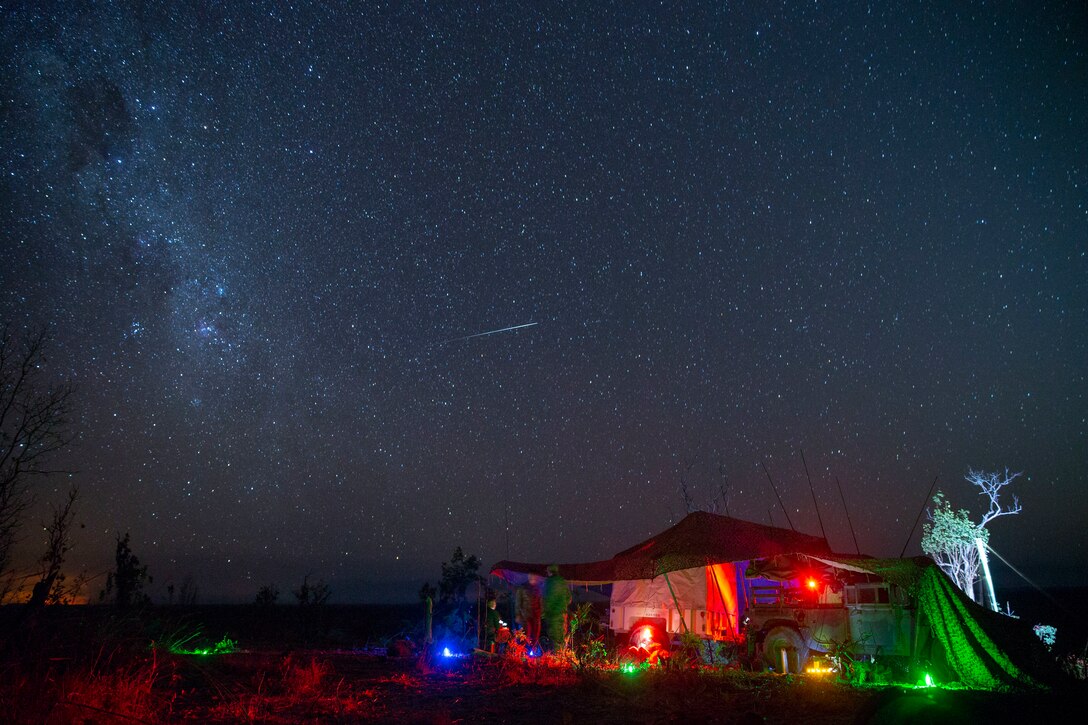 U.S. Marines man the fire support command center and process intelligence collected from the small unmanned aerial surveillance drone Raven RQ-11B as part of force-on-force training in Mount Bundey Training Area, Northern Territory, Australia, July 20.