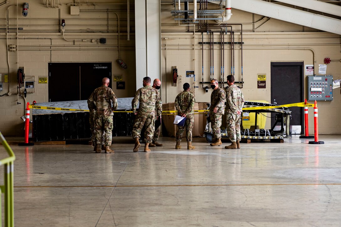 Photo of Airmen briefing the LATT.